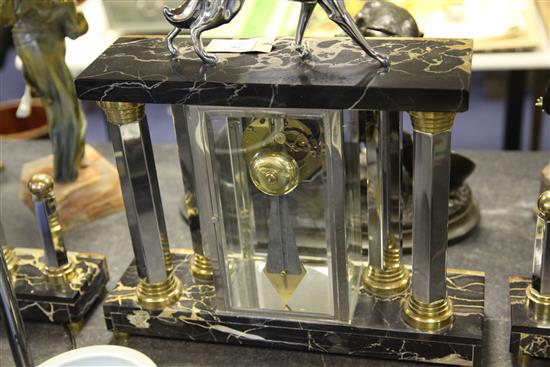 Attributed to Michel Decoux. A French Art Deco marble, onyx and chrome clock garniture, clock 20in.